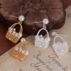 The new mid-style pearl flower basket earrings are niche, exquisite and high-end. The stud earrings are fashionable, elegant, trendy and versatile Application Scenario